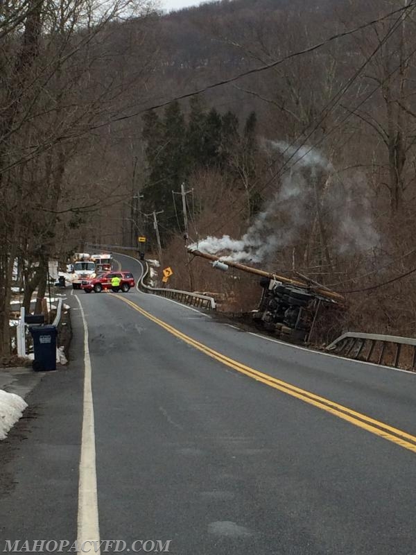 03/28/18 10:45am MVFD operating on Long Pond Rd at a rollover dump truck involving power lines on vehicle. 